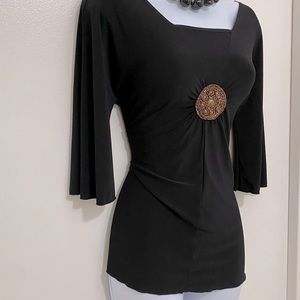 Saint Tropez West NWOT Flowing top with emblem. Polyester and spandex